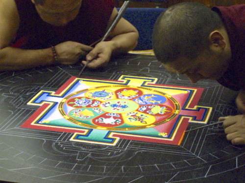 Buddhist monks creating mandala