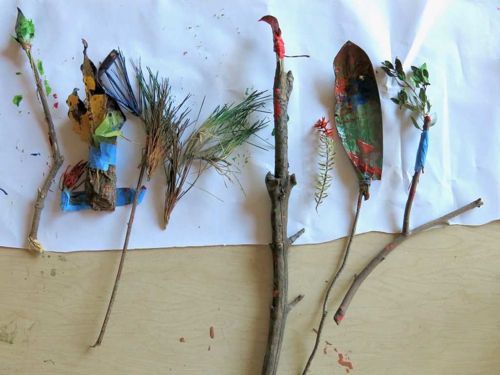 Paint brushes made from twigs, pine needles, bark, plants, and other natural objects.