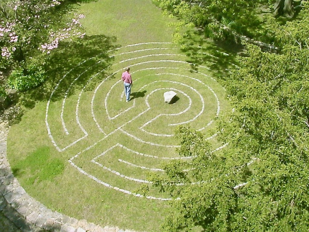 Aerial view of a labyrinth in a lawn.